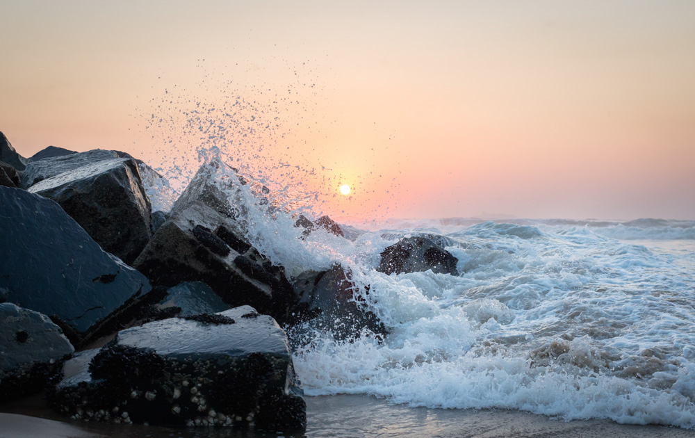 Umgeni River Estuary Sunrise with Waves Crashing over Rocks at Blue Lagoon Beach in Durban